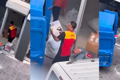 KARGO ÇALIŞANLARI KOLİLERİ KAMYONA FIRLATARAK YÜKLEDİ