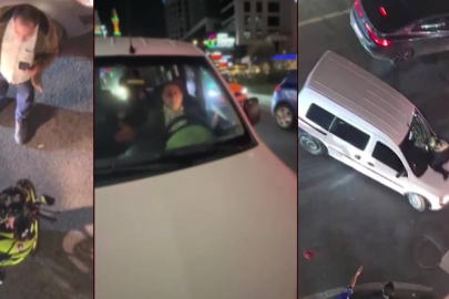 YOL VERME KAVGASI: KADIN MOTORCUYU KAPUTUNDA SÜRÜKLEDİ