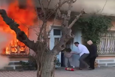 KEDİSİNİ KURTARMAK İÇİN ALEVLERİN İÇİNE DALDI